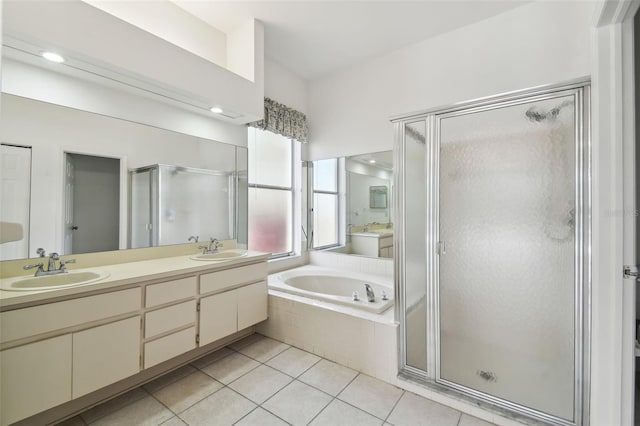 bathroom with separate shower and tub, vanity, and tile patterned floors