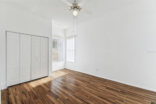 unfurnished bedroom featuring a textured ceiling, ceiling fan, and a closet