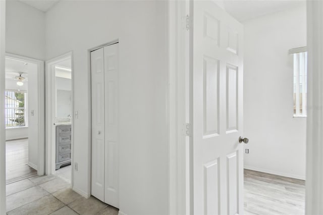 hallway featuring light tile patterned flooring