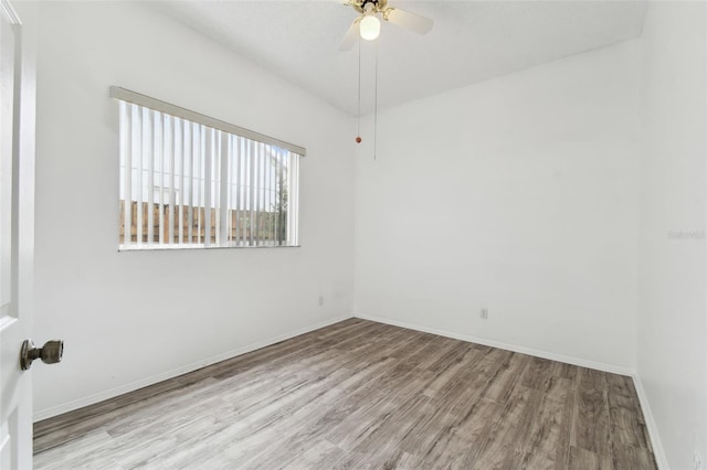 unfurnished room featuring ceiling fan and light hardwood / wood-style floors