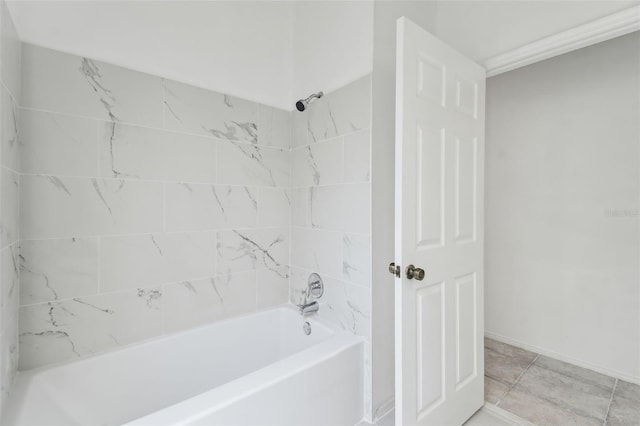 bathroom featuring tiled shower / bath and tile patterned floors