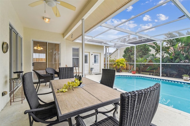 view of swimming pool featuring a patio area and a lanai