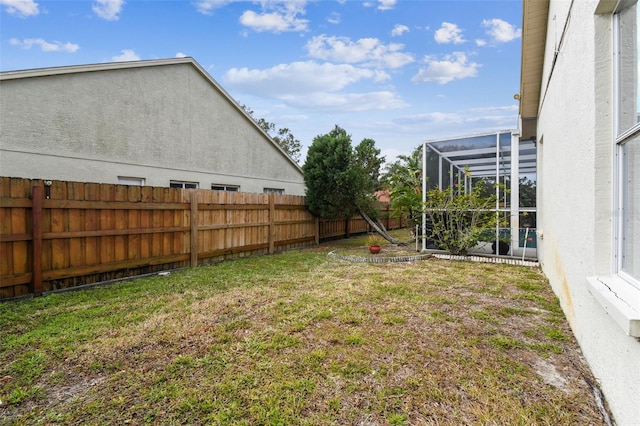 view of yard featuring a lanai