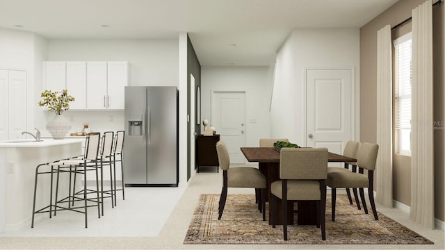 dining space with sink and a wealth of natural light