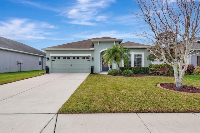 view of front of property with a garage and a front yard