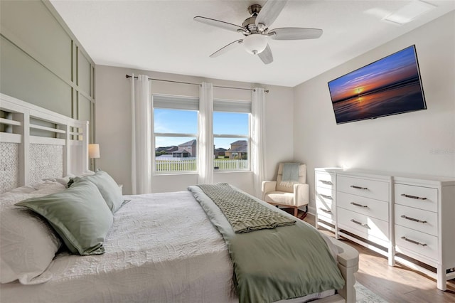 bedroom featuring ceiling fan and light hardwood / wood-style flooring