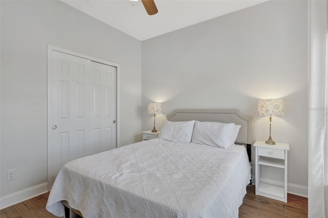 bedroom with ceiling fan, hardwood / wood-style flooring, and a closet