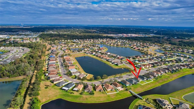 birds eye view of property featuring a water view