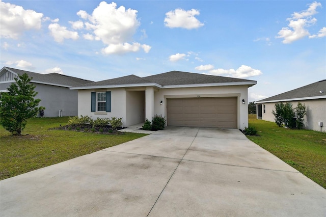 view of front of home with a garage and a front yard