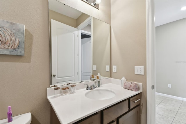 bathroom featuring tile patterned floors and vanity