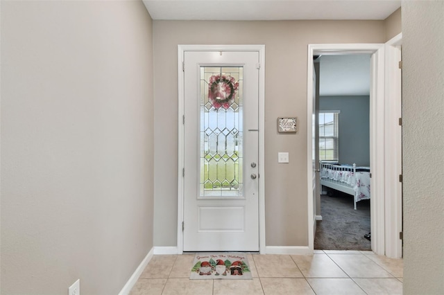 entryway featuring light tile patterned floors