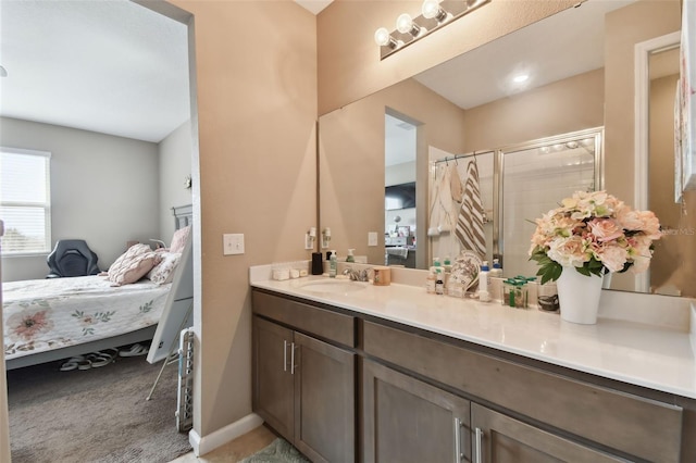 bathroom with walk in shower and vanity