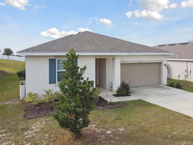 ranch-style home with a garage and a front lawn