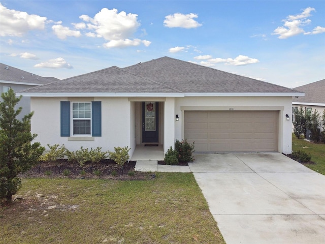 ranch-style house with a front yard and a garage