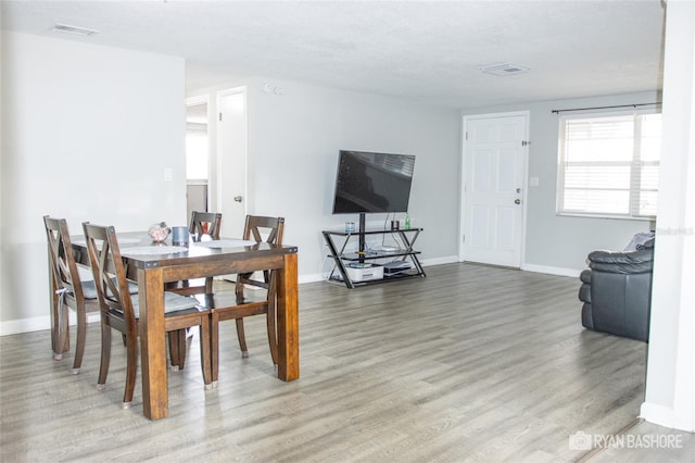 dining room with hardwood / wood-style floors