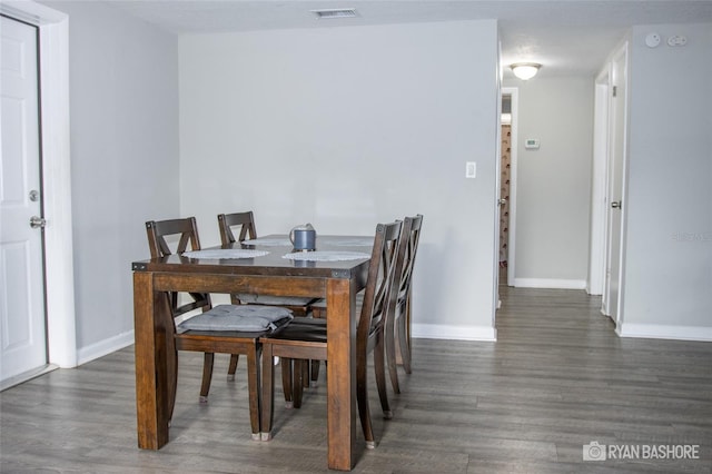 dining room with dark hardwood / wood-style floors