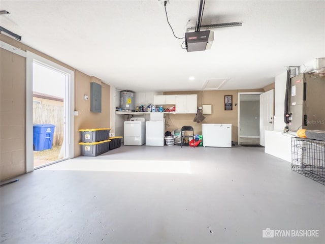 garage featuring electric water heater, electric panel, fridge, washer and clothes dryer, and a garage door opener