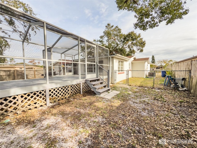 view of yard with a lanai and a deck