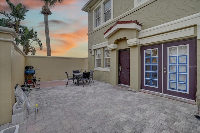 patio terrace at dusk with french doors