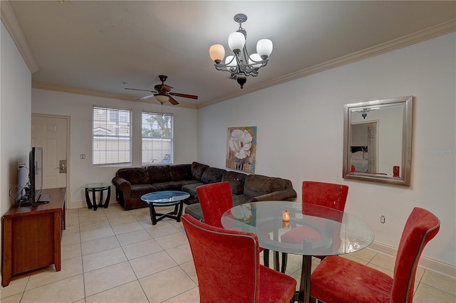 dining room with light tile patterned floors, ceiling fan with notable chandelier, and crown molding