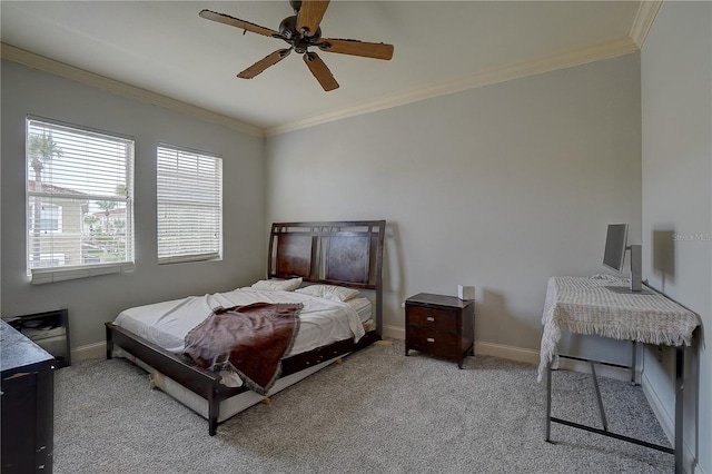 carpeted bedroom with ceiling fan and crown molding