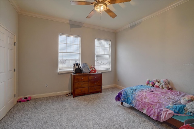 carpeted bedroom featuring ceiling fan and crown molding