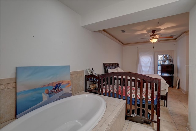 bedroom with ceiling fan, light tile patterned floors, and crown molding