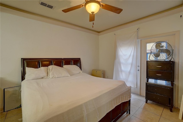 bedroom featuring ceiling fan, light tile patterned floors, and ornamental molding