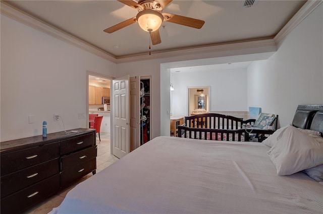 bedroom with ceiling fan, ensuite bathroom, light tile patterned floors, and ornamental molding