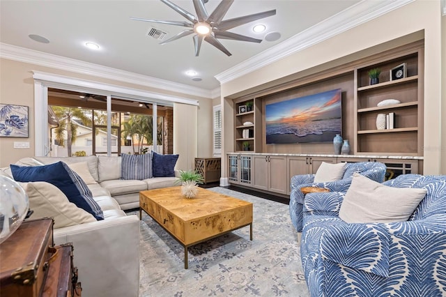 living room featuring ceiling fan, ornamental molding, and built in features