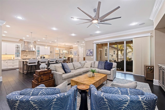 living room featuring ceiling fan, dark hardwood / wood-style floors, and ornamental molding