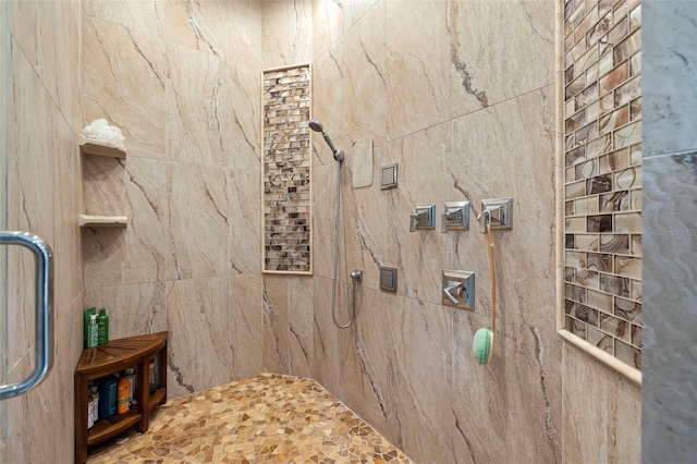 bathroom with tiled shower