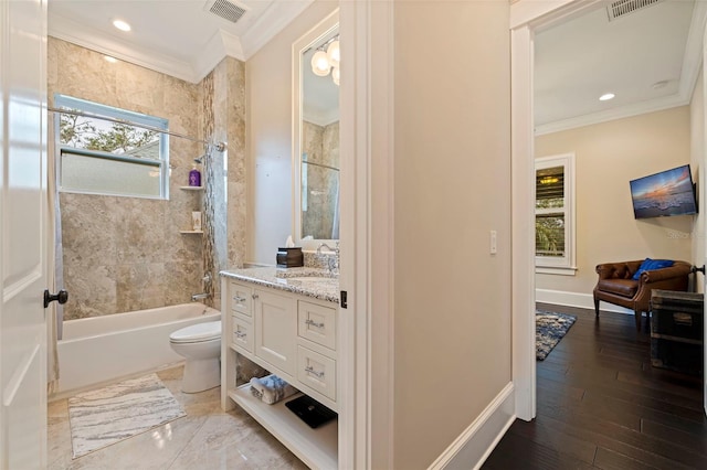 full bathroom with toilet, vanity, crown molding, and a healthy amount of sunlight