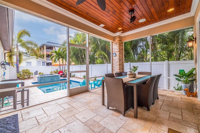 sunroom with ceiling fan and wood ceiling