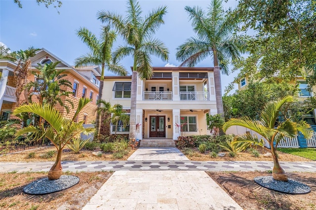 310 8th Ave N, Saint Petersburg, FL 33701 - view of front of home with a ceiling fan, a balcony, french doors, and a porch
