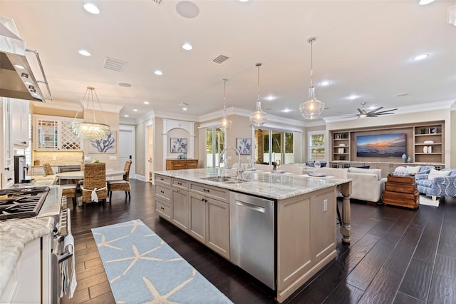 310 8th Ave N, Saint Petersburg, FL 33701 - kitchen with a sink, stainless steel appliances, crown molding, a spacious island, and recessed lighting