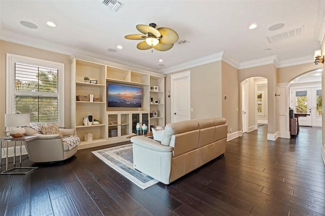 310 8th Ave N, Saint Petersburg, FL 33701 - living area featuring arched walkways, a ceiling fan, dark wood-style flooring, ornamental molding, and recessed lighting