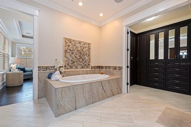 310 8th Ave N, Saint Petersburg, FL 33701 - full bath featuring a bath, crown molding, tile patterned flooring, recessed lighting, and a wainscoted wall
