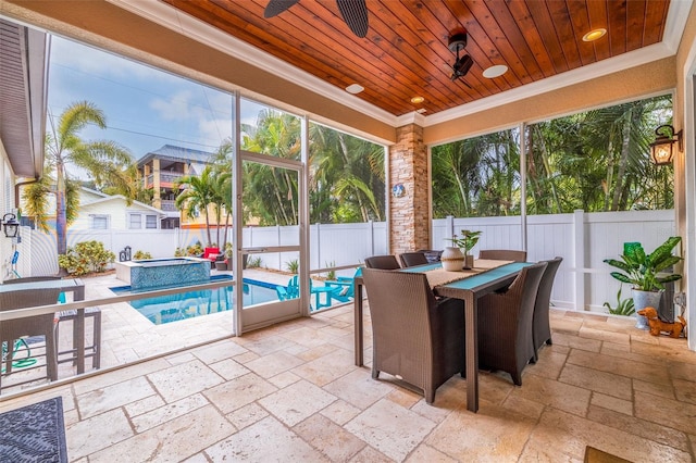 310 8th Ave N, Saint Petersburg, FL 33701 - sunroom / solarium featuring stone tile floors, ornamental molding, wood ceiling, healthy amount of natural light, and a jacuzzi