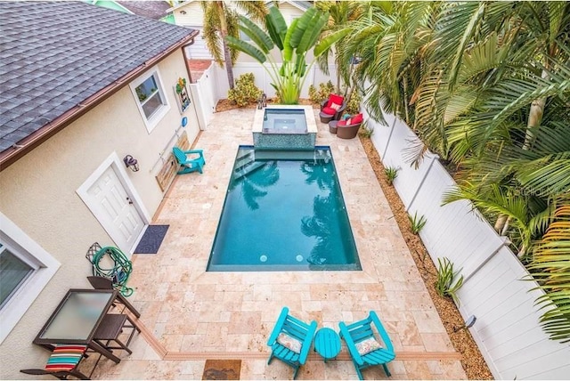 310 8th Ave N, Saint Petersburg, FL 33701 - view of swimming pool featuring a fenced backyard, a patio, and a pool with connected hot tub