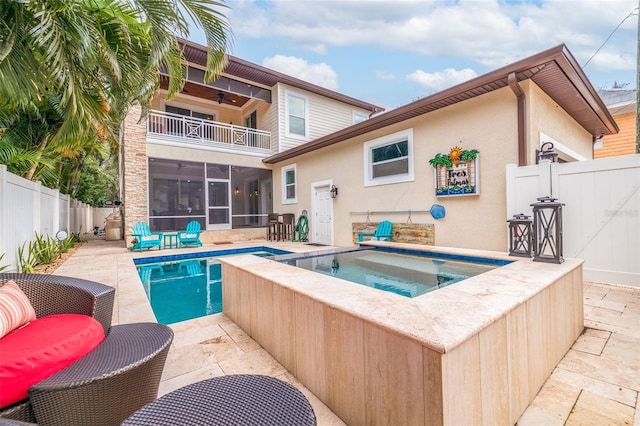310 8th Ave N, Saint Petersburg, FL 33701 - view of pool with a sunroom, an in-ground hot tub, a ceiling fan, a fenced backyard, and a patio