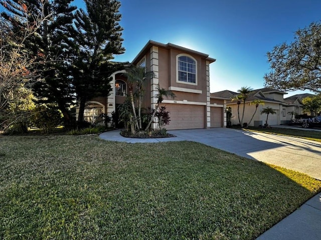 front of property featuring a garage and a front yard