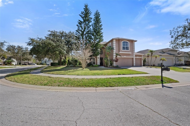 view of front facade featuring a garage and a front lawn