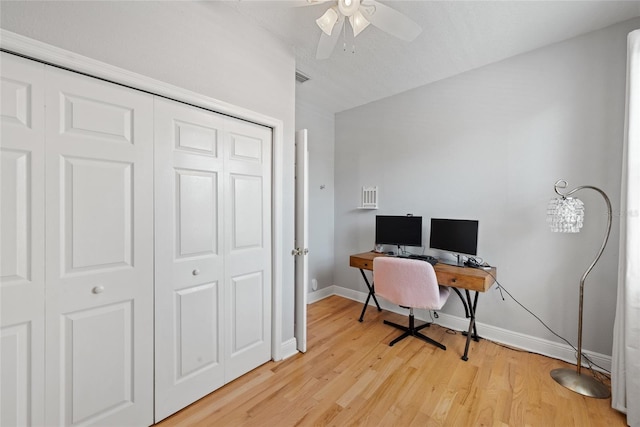 office featuring ceiling fan and light hardwood / wood-style floors