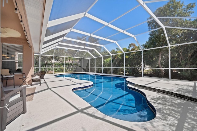 view of pool featuring a lanai and a patio