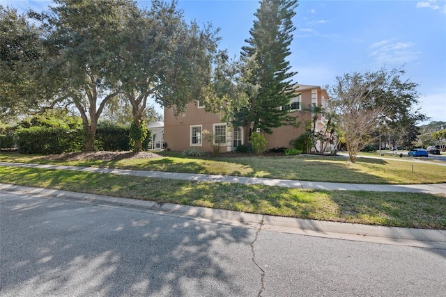 view of front of property with a front lawn