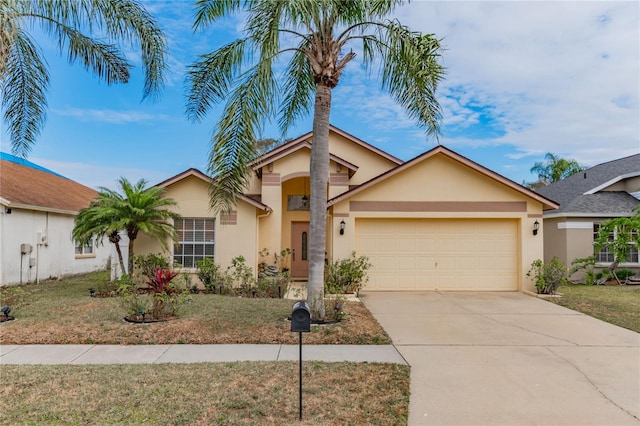 view of front of home featuring a front yard and a garage