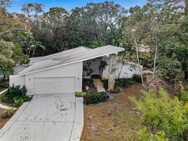 view of property exterior featuring a garage