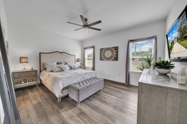 bedroom featuring ceiling fan and hardwood / wood-style flooring