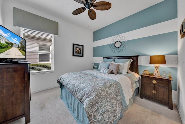 bedroom featuring ceiling fan and light colored carpet